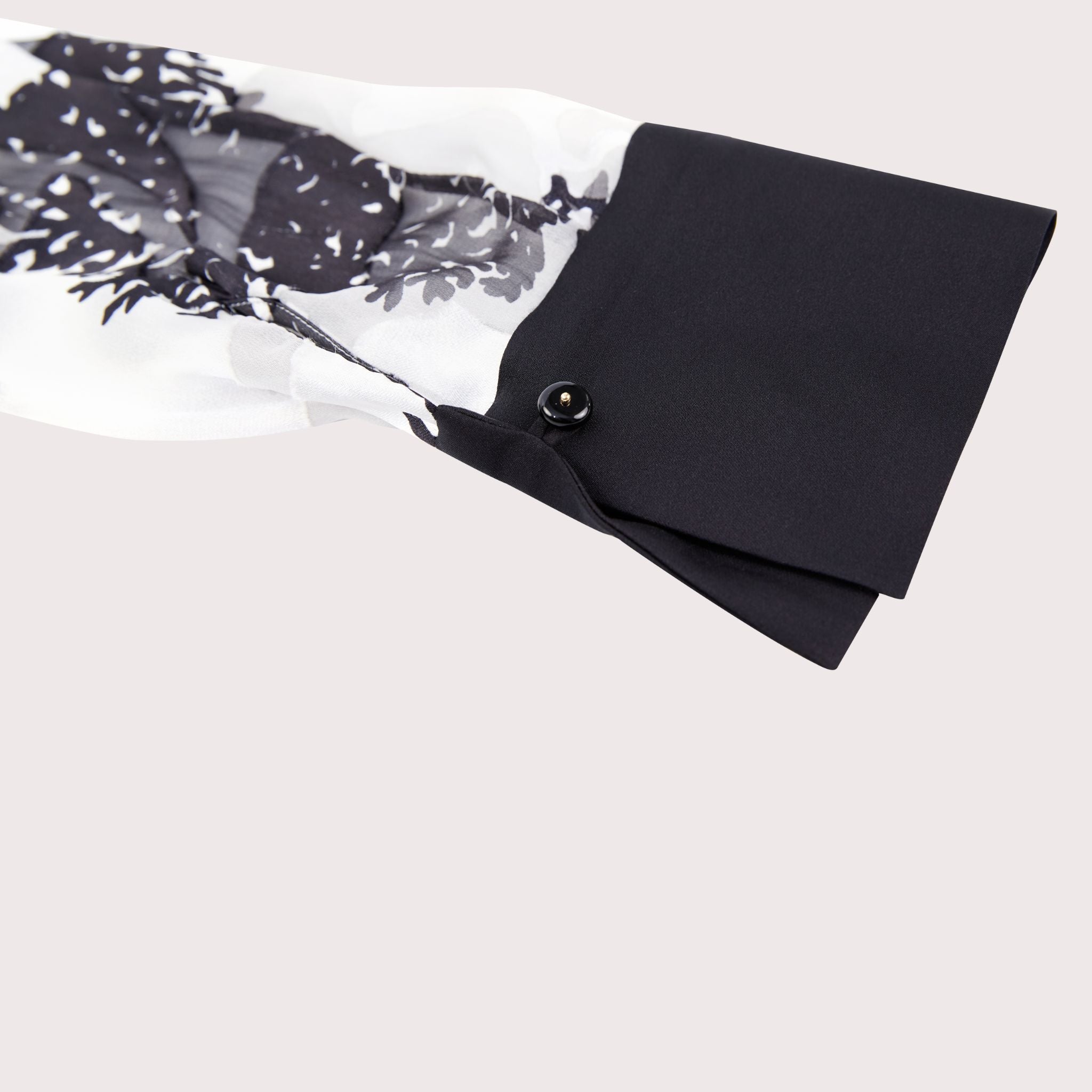 closeup of the sleeve detail on a burnout silk shirt