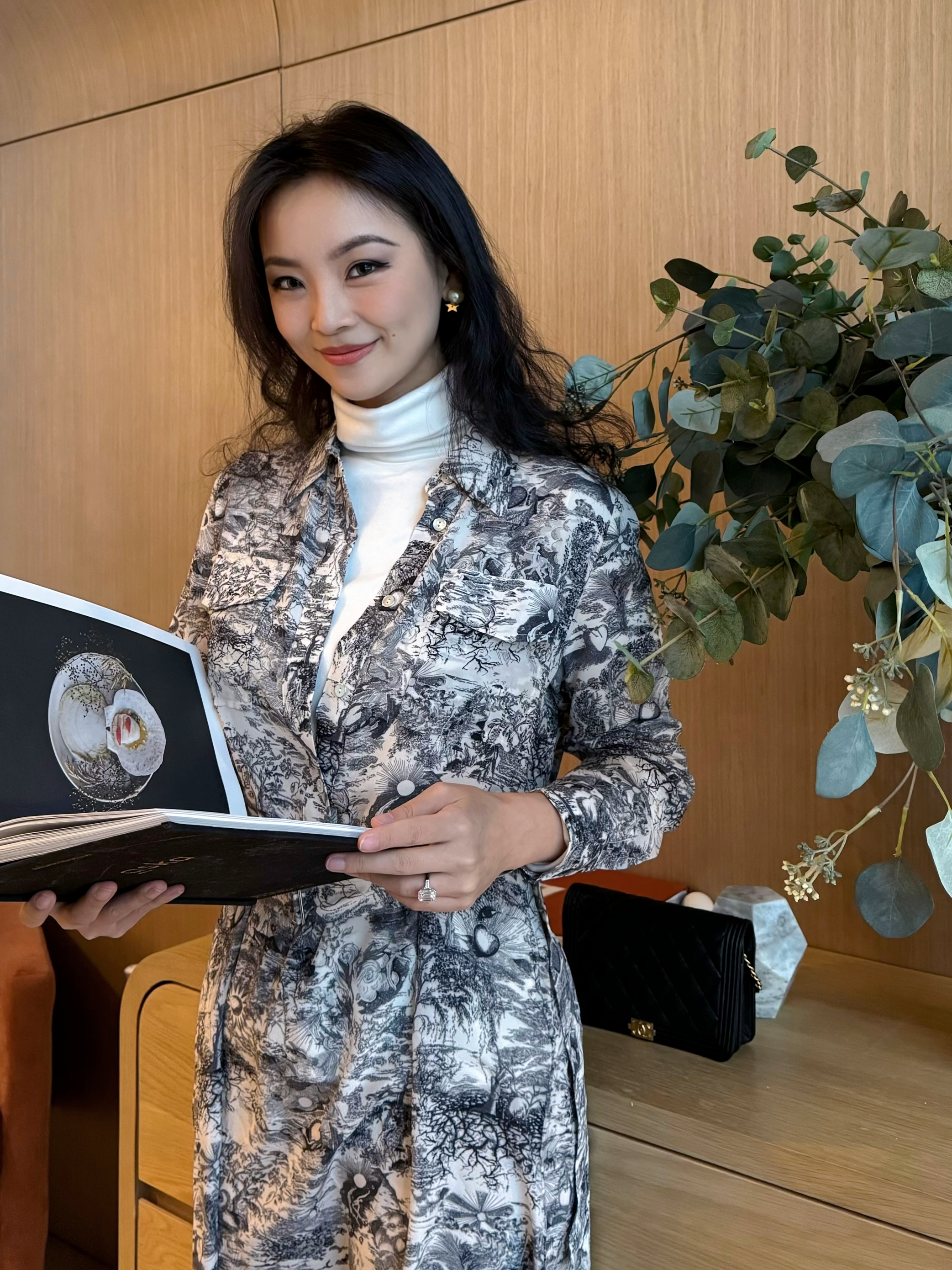 model posing in printed silk dress