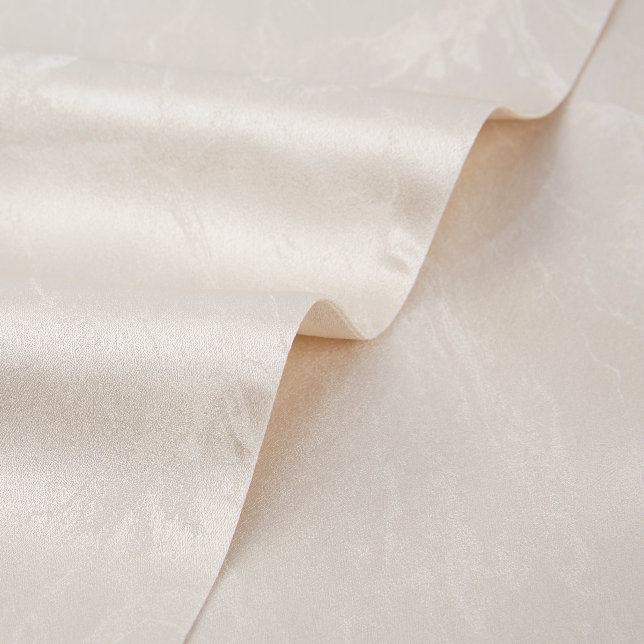 closeup of the fabric texture on a white silk jacket