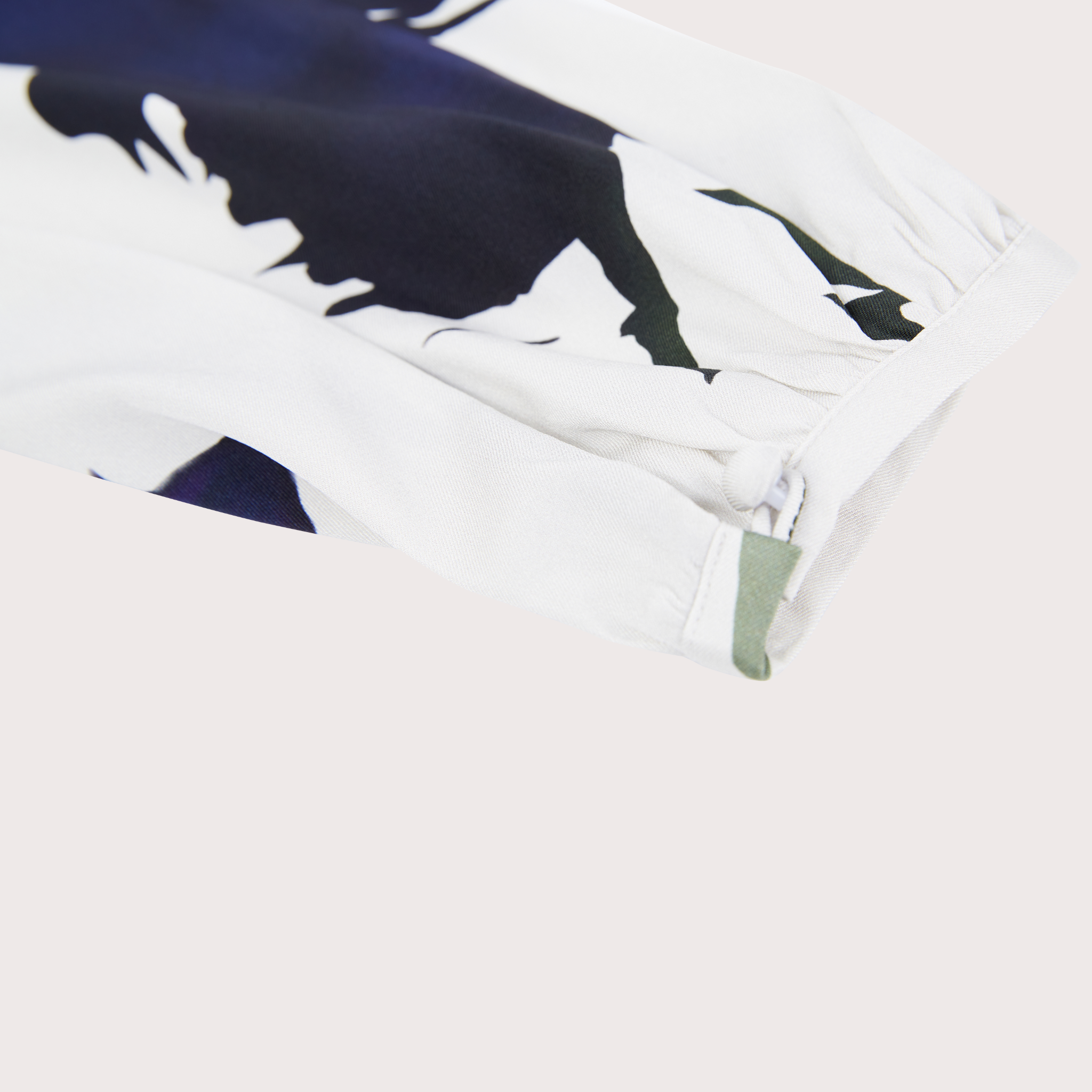 closeup of the sleeve detail on a wrap front blouse