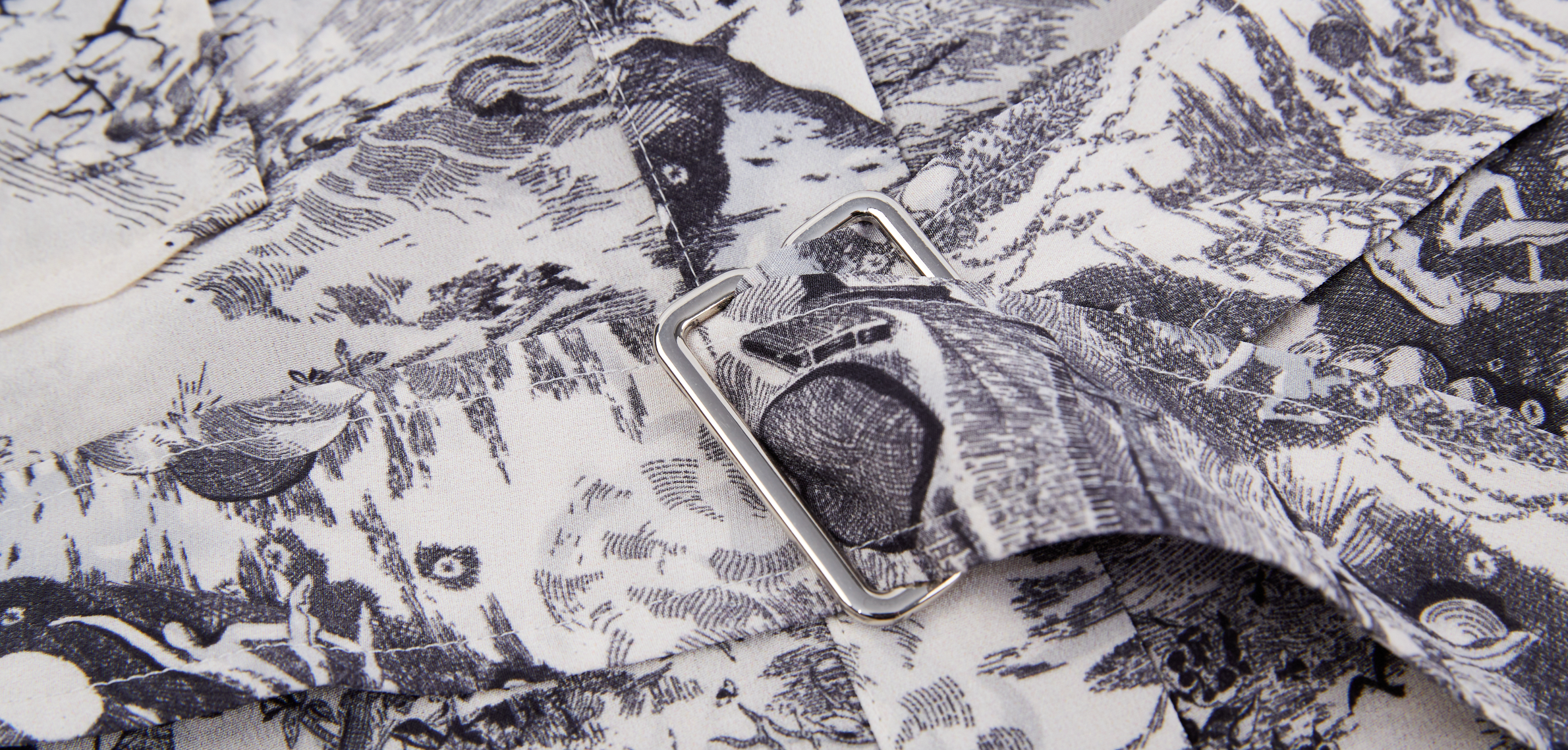 closeup of a printed silk dress, showcasing intricate patterns and luxurious texture