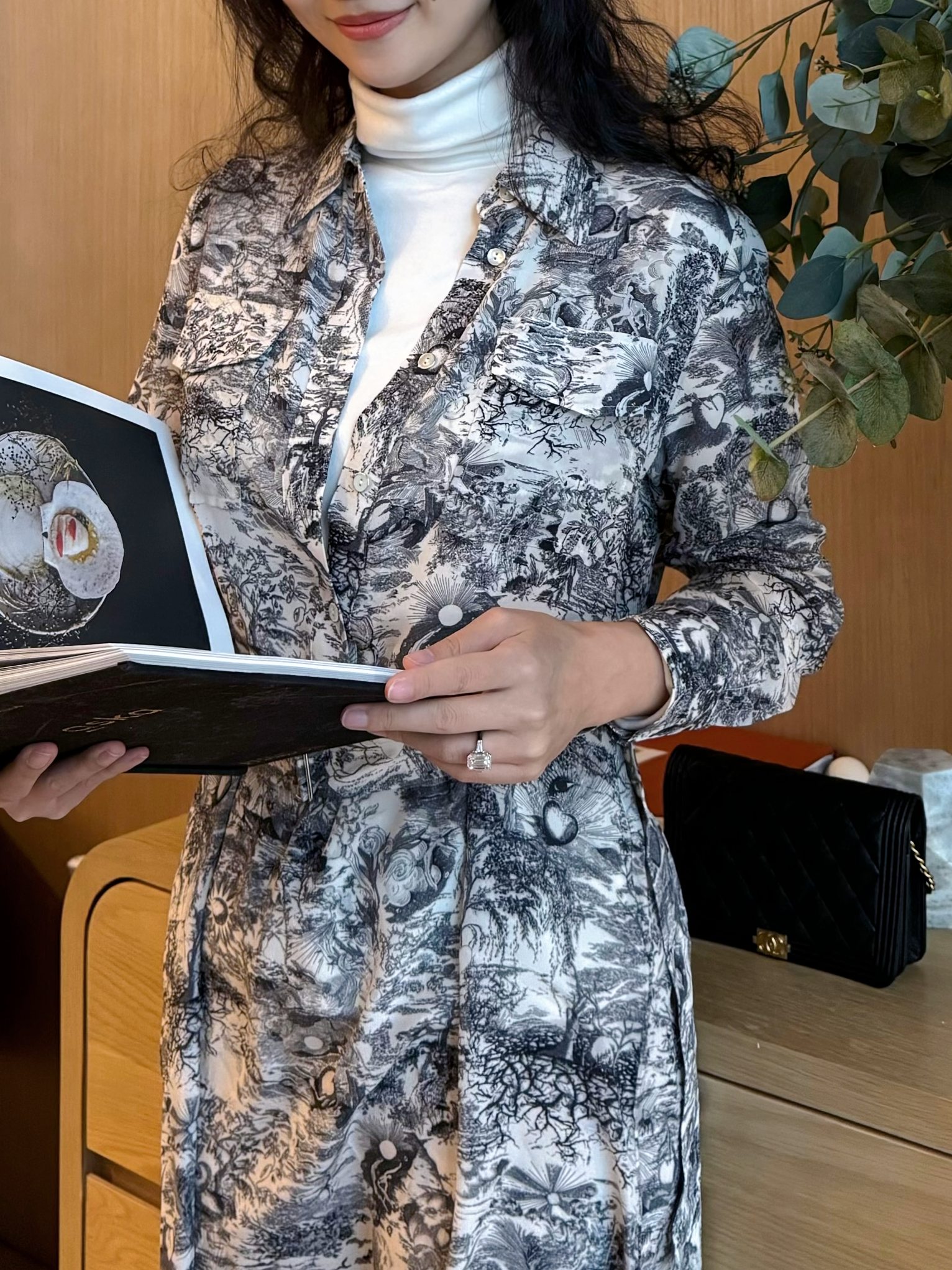 model posing in printed silk dress